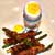 Soft boiled duck egg with bacon and asparagus soldiers